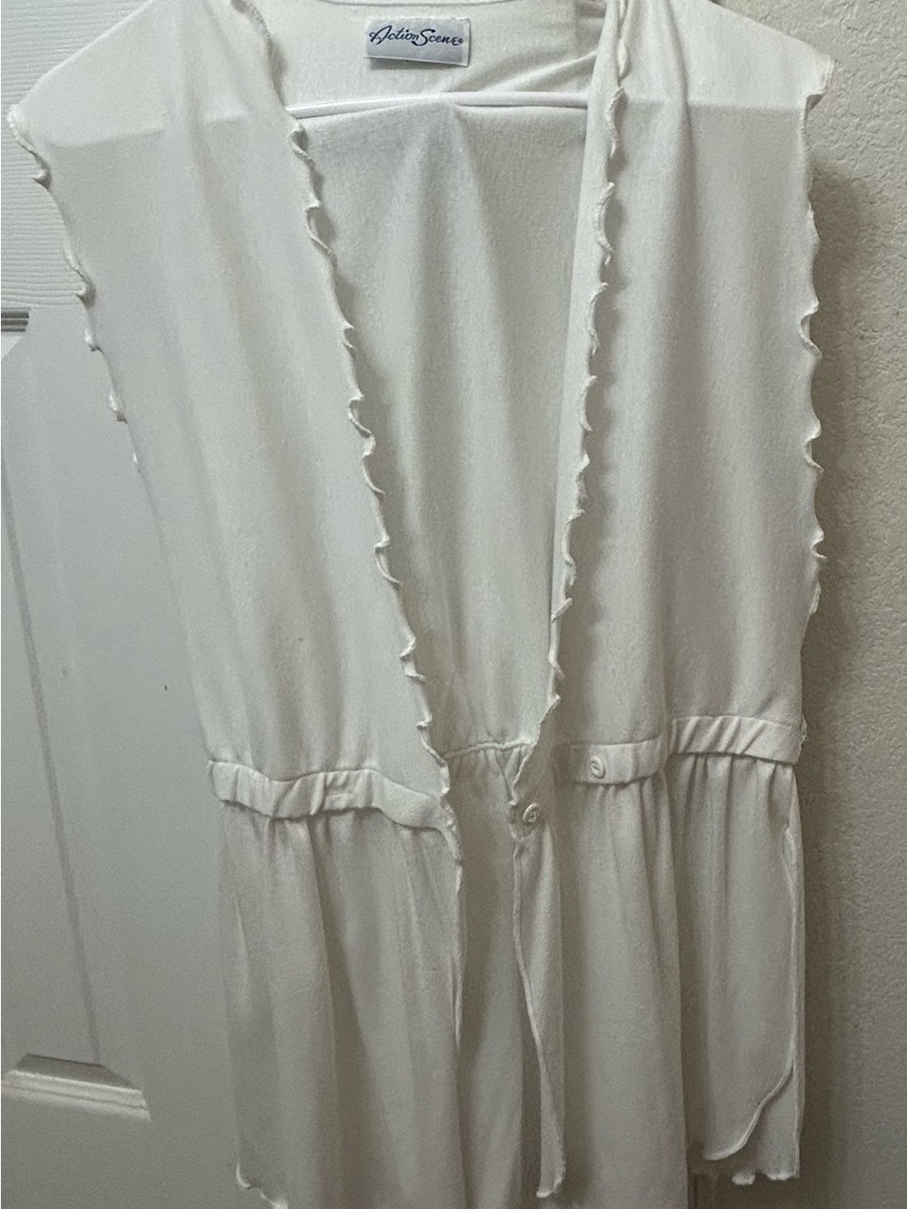 Action Scene Cream Ruffled Sleeveless Cardigan